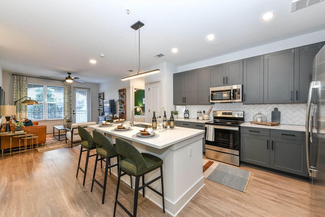 Kitchens are complete with an entertaining island and quartz countertops. - Elevate West Village