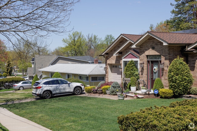 Well-maintained homes and lawns line the streets of River Edge, NJ.
