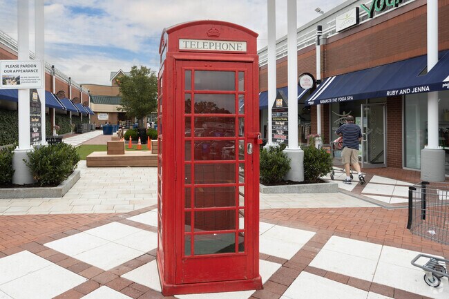 An old red telephone booth decorates one of the many shopping centers in Plainview, NY.