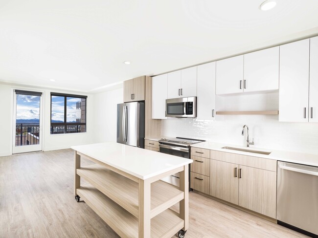 Creating culinary magic with a chef's dream island complete with ample storage, found in the heart of Modera Golden Triangle, Denver, Colorado. - Modera Golden Triangle