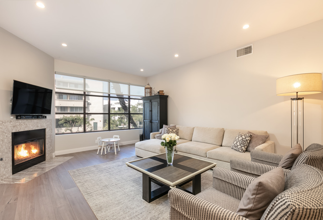 Living room with fireplace - 11636 Montana Ave