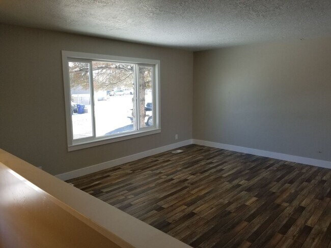 Photo - Spacious 5-Bedroom Magna Home with Deck and Ample Parking