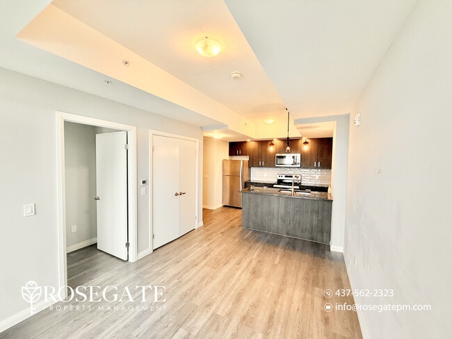 Photo du bâtiment - Modern 1-Bedroom Condo with Balcony in Dow...