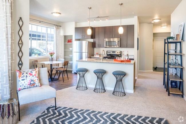 Luxury vinyl plank flooring in entryway and kitchen - Victory Flats at Elmonica Station Apartments