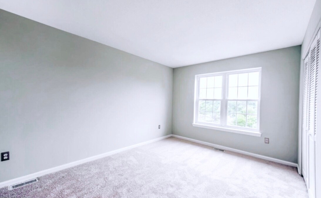 Master bedroom, professionally steam cleaned carpet, large windows - 4767 Kandel Ct