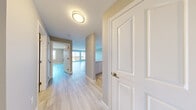 Located at 109 Greenpark Close in Halifax, Nova Scotia, this 1-bedroom, 1-bathroom unit offers a thoughtfully designed single-floor layout with a clean, modern aesthetic throughout. Light-toned hardwood flooring flows consistently across all rooms, complemented by warm neutral wall tones and crisp white trim and doors that give the space a fresh, airy feel.

The living room is generously sized, bathed in natural light from large windows and a sliding glass door that opens onto a private balcony with open outdoor views — ideal for enjoying Halifax's scenic surroundings. The kitchen is well-equipped with sleek white cabinetry, a grey tile backsplash, light countertops, and stainless steel appliances including a refrigerator and dishwasher.

The spacious primary bedroom features a large window with pleasant outdoor views, providing ample natural light and a calm atmosphere. The full bathroom is finished in a clean white palette, complete with a tub-shower combination, vanity, and toilet — all accented by light hardwood-style flooring.

A dedicated laundry area with full-sized washer and dryer adds everyday convenience, while a closet provides practical storage. The hallway connects all rooms efficiently, with textured ceilings and modern flush-mount lighting completing the well-maintained interior.