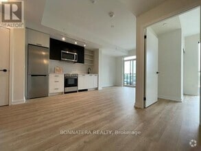 Building Photo - 2306-2306 St Clair Ave W