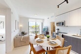 Located in Miami Gardens, FL, this modern 2-bedroom, 3-bathroom residence offers a thoughtfully designed open-concept layout. The combined kitchen and living area serves as the heart of the home, filled with natural light streaming through floor-to-ceiling sliding glass doors that open onto a private balcony with scenic outdoor views of lush greenery. The kitchen is outfitted with sleek two-tone cabinetry — pairing white gloss uppers with dark wood-grain lowers — white subway tile backsplash, stainless steel appliances, and clean quartz countertops. A round marble-top dining table provides an elegant dining area just adjacent to the kitchen. The living room is bright and airy, anchored by the balcony access that brings in abundant Florida sunlight. Both bedrooms are clean and minimalist, featuring light-toned flooring and ample space, with the spacious primary bedroom offering generous proportions. Two dedicated closets add to the practical storage throughout. The three bathrooms maintain the contemporary aesthetic, featuring dark wood vanities with white countertops, large mirrors, and a glass-enclosed shower in the primary bath. A hallway connects the private quarters seamlessly. The overall ambiance is clean, modern, and welcoming.