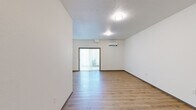 Located in Spokane Valley, WA, this single-floor unit offers three bedrooms, one bathroom, a kitchen, a hallway, and a closet within a thoughtfully laid-out floor plan. The main living area is bright and open, featuring light-toned luxury vinyl plank flooring, crisp white walls, and a textured ceiling. A sliding glass door with vertical blinds fills the space with natural light and provides access to the outdoors, while a wall-mounted mini-split air conditioning unit ensures year-round comfort. The kitchen is outfitted with white shaker-style cabinetry, stainless steel appliances including an electric range and over-the-range microwave, and a dishwasher — offering a clean, modern aesthetic with ample storage. The bedrooms are carpeted and well-lit by natural light through slatted blinds, providing a cozy and quiet retreat. The primary bedroom offers a comfortable footprint suited for a standard bedroom set. The bathroom features wood-look LVP flooring, a white vanity with under-cabinet storage, a large mirror, and a baseboard heater. Throughout the unit, a consistent neutral palette and clean finishes create a fresh, move-in-ready atmosphere.