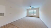 This 990 square foot apartment in Kernersville, NC offers a thoughtful layout with two bedrooms and two bathrooms. The primary bedroom, measuring 160 square feet, provides ample space for comfort. The modern kitchen is a standout feature, boasting rich wood cabinetry, granite countertops, and stainless steel appliances, including a built-in microwave. The open concept living and dining area is illuminated by large windows and enhanced by a ceiling fan.

Both bedrooms are carpeted for comfort and feature windows for natural light. The bathrooms are equipped with modern fixtures, including a combination tub-shower, and vanities with granite countertops. Storage solutions include wire shelving in the closets.

The apartment's neutral color palette, with white walls and beige carpeting in the bedrooms, creates a bright and airy atmosphere. Wood-look flooring in the common areas adds warmth and durability. The overall design prioritizes functionality and modern aesthetics, making efficient use of the available space.
