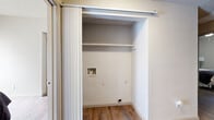 This 2-bedroom, 2-bathroom residence in Austin, TX is thoughtfully laid out across a single floor, offering a practical and comfortable living environment. The combined kitchen and living room serves as the heart of the home, featuring wood-style flooring, a ceiling fan, and built-in shelving that adds character and storage. The kitchen is equipped with dark cabinetry, granite-style countertops, stainless steel appliances including a refrigerator and dishwasher, making it both functional and stylish. Natural light filters in through window treatments in the living area, creating a bright and welcoming atmosphere.

Both bedrooms are well-proportioned, each featuring wood-style flooring, ceiling fans, and windows that bring in natural light. The primary bedroom includes a closet with sliding doors, while the second bedroom also offers dedicated closet space. A hallway connects the rooms, maintaining a clear and organized flow throughout.

The two bathrooms are finished with granite-style countertops, dark wood vanities, and marble-style tiled tub-shower combinations. One bathroom features an extended vanity, offering generous counter and storage space. A dedicated laundry closet with hookups and built-in shelving adds everyday convenience to this well-appointed Austin residence.