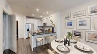 Located at 27942 Forbes Rd in Laguna Niguel, CA, this thoughtfully designed one-bedroom, one-bathroom residence offers a modern aesthetic with high-quality finishes throughout its efficiently utilized single-floor layout. The open-concept kitchen and living area serves as the heart of the home, featuring sleek white flat-front cabinetry that extends to the ceiling, a marble-look tile backsplash, dark quartz countertops, stainless steel appliances including a side-by-side refrigerator, dishwasher, microwave, and range, and a peninsula with bar seating — ideal for casual dining or entertaining. Rich wood-tone flooring runs continuously through the main living areas, grounding the bright, neutral palette. The living room is bathed in natural light from expansive floor-to-ceiling windows that frame outdoor views of palm trees and the surrounding community. The bedroom offers a serene retreat with large windows, a ceiling fan, and a dedicated closet. The bathroom is finished with large-format marble-look tile flooring, a floating vanity with dark countertop, a well-lit mirror, and a tiled soaking tub and shower combination. Recessed lighting throughout enhances the clean, contemporary ambiance of this well-appointed Laguna Niguel residence.