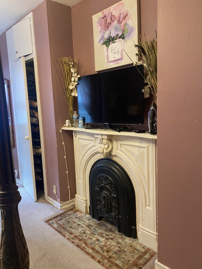 Bdrm 1: unique beautiful antique fireplace mantle; fireplace not functional. - 1654 N Marshall St