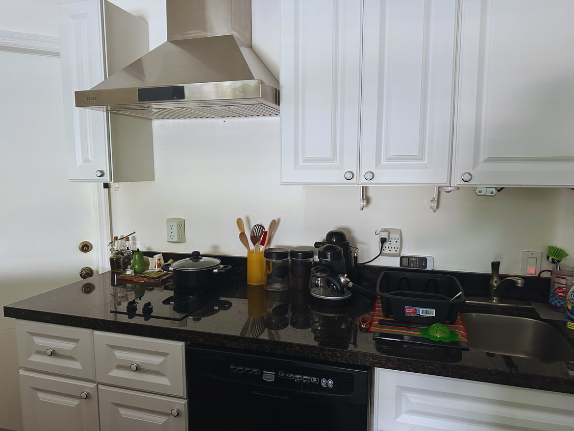 Kitchen with exhaust extractor vented directly outside and dishwasher - 13835 SW 39th Ter