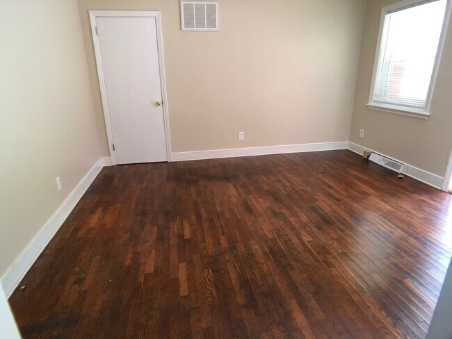 Building Photo - Two Bedroom Triplex on E. Bessemer