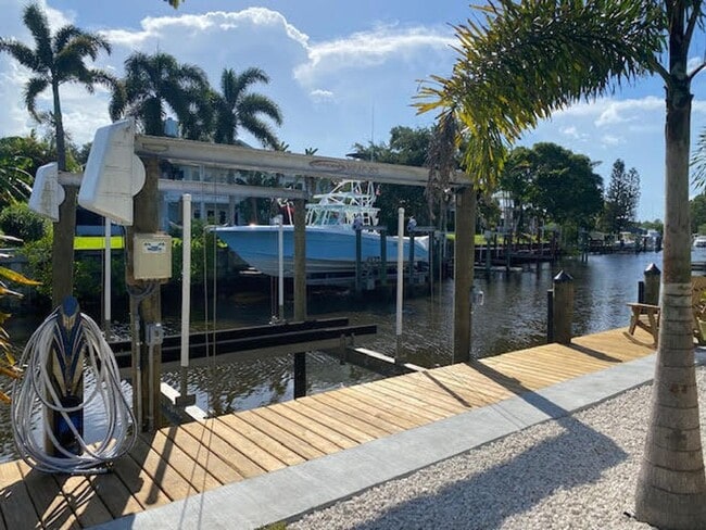 Building Photo - Palm City Home with Dock and Lift