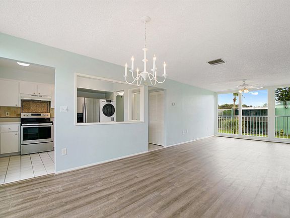 Living Room and Dining Room Looking Into Kitchen - 5500 Ocean Shore Blvd
