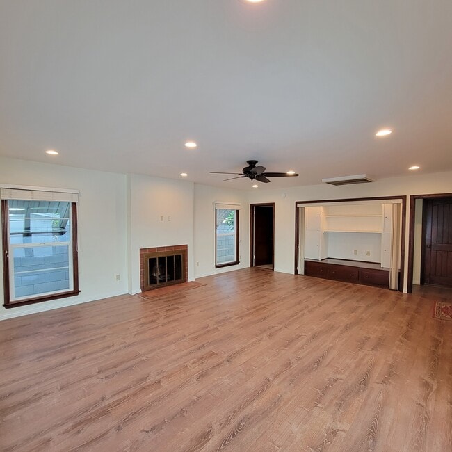 Living room showing LED ceiling lights and additional storage area - 1331 Barrington Way