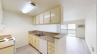 Located at 3415 Linden Ave in Long Beach, California, this one-bedroom, one-bathroom unit offers a thoughtfully arranged floor plan across a single level. Light wood-style flooring flows throughout the entire space, lending a clean, cohesive aesthetic from room to room.

The heart of the unit is an open-concept area combining the living room, dining room, and kitchen. The kitchen features cream-toned cabinetry with ample upper and lower storage, granite-style countertops, a double-basin sink, a white electric range, and a dishwasher. A peninsula counter separates the kitchen from the living and dining areas, creating a natural flow. Sliding glass doors in the living area open directly onto a private balcony, filling the space with natural light.

The generously sized bedroom includes a ceiling fan, a large window with vertical blinds for light control, and direct access to closet space. Three closets throughout the unit provide exceptional storage. The bathroom features a cream vanity with a granite-style countertop, a large mirror, and light wood-style flooring consistent with the rest of the home.

A hallway connects the primary living spaces to the bedroom and bathroom, maintaining a functional and organized layout. Ceiling fans in both the living area and bedroom ensure year-round comfort.
