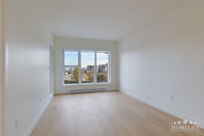 Photo du bâtiment - Modern 2-Bedroom Condo at The District at ...