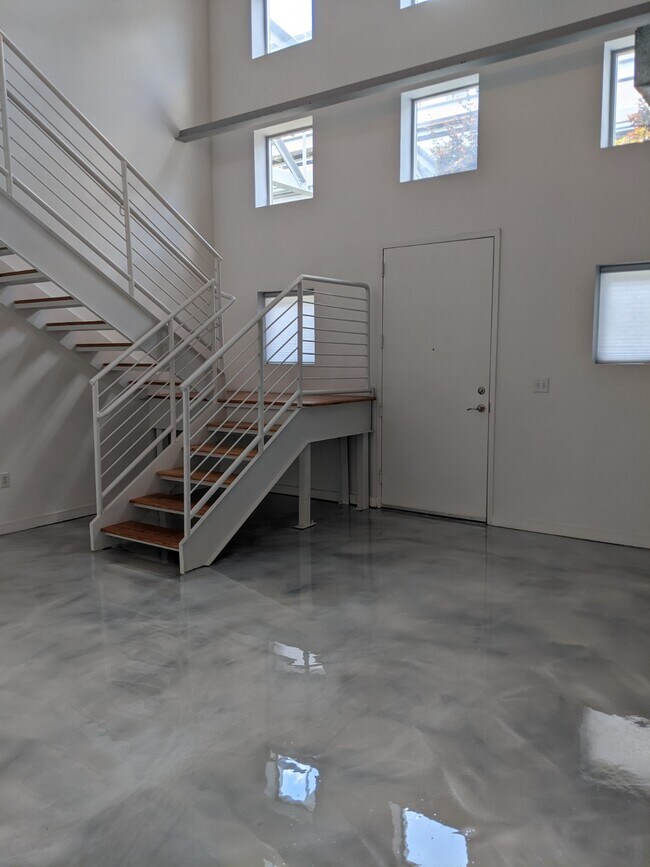 Living Room facing Stairs - 400 Village Pkwy