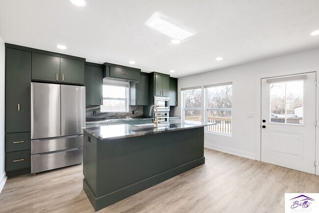 Building Photo - BE PREPARED TO BE AMAZED!! 4 CAR GARAGE IS...