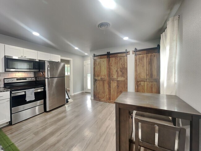Building Photo - Front Porch Charm & Backyard Dreams!