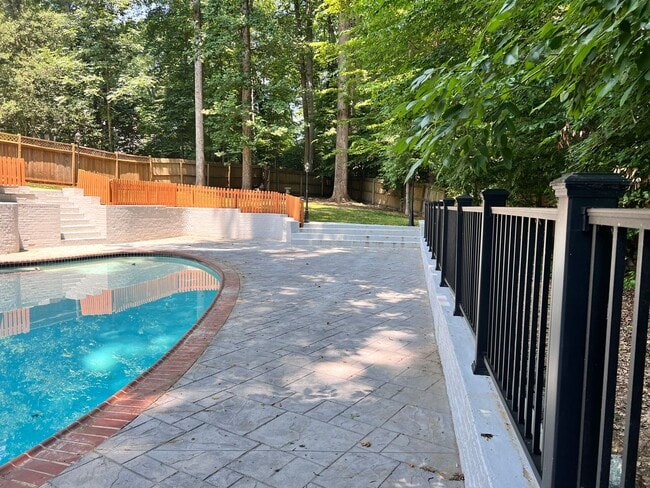Photo - 5 BR 4.5 BA home with inground heated pool and extensive hardscape!
