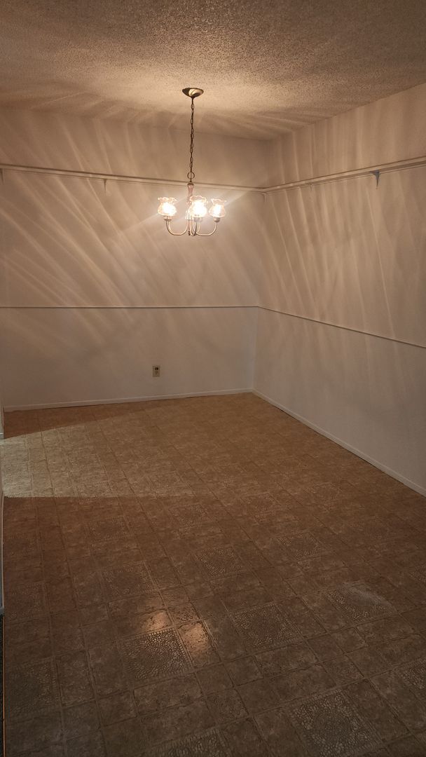 Building Photo - This unit is freshly painted with new carp...