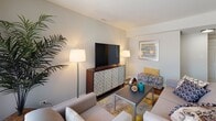 Located at 1769 Robin Ln in Lisle, Illinois, this two-floor home offers a well-designed layout with thoughtfully appointed spaces throughout. The living room is bright and welcoming, featuring large sliding glass doors with vertical blinds that invite natural light and outdoor views, complemented by wood-look flooring and a comfortable, contemporary arrangement. Adjacent to the living area, a dedicated dining space features a ceiling fan with light fixture, a glass-top dining table, and additional sliding door access, creating an airy, open feel. The galley-style kitchen is updated with crisp white cabinetry, black hardware accents, a mosaic tile backsplash, stainless steel appliances including a gas range and French door refrigerator, and light countertops that maximize the functional layout. A conveniently located bathroom with wood-look flooring and clean white millwork serves the main level. Upstairs, the primary bedroom offers a serene retreat with neutral tones, plush carpeting, and a closet, while a secondary bedroom features twin beds, built-in closet storage, and vibrant, playful décor. A carpeted upper hallway leads to a spacious walk-in closet with multi-tier shelving, providing generous storage. Throughout the home, neutral wall tones, consistent finishes, and carefully chosen details contribute to a cohesive and inviting atmosphere.