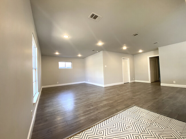 Living room has tile floor entry, window shades, recessed lights - 306 W Northgate Dr