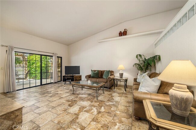 Living Room, Vaulted Ceiling, with working fireplace. - 46375 Ryway Pl