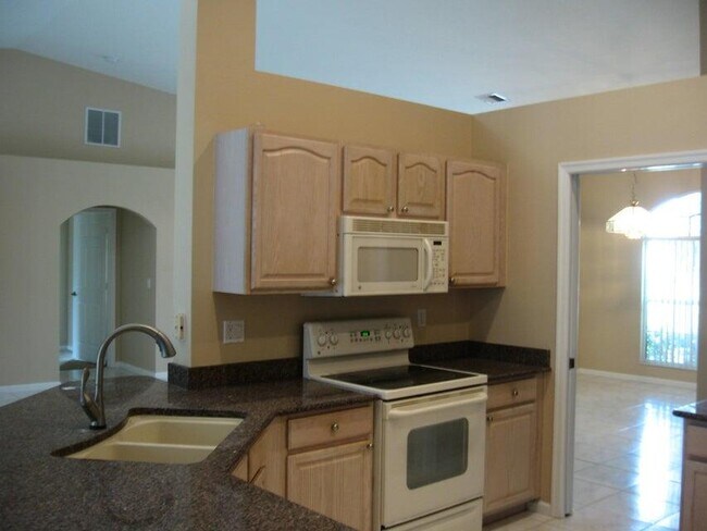 Building Photo - 5811 NW Rose Petal Ct
