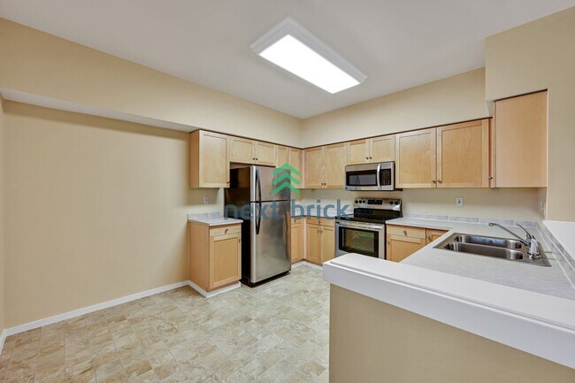 Building Photo - Rare Ground-Floor, End Unit with massive b...