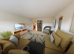 Located at 1275 Gerling Street in Schenectady, NY, this single-floor apartment offers 540 square feet of functional living space across 3 bedrooms, 1 bathroom, a kitchen, and a hallway. The unit features a clean, neutral aesthetic with white walls and textured ceilings throughout. The bedrooms are carpeted in warm beige tones, providing a comfortable feel underfoot. The primary bedroom, at 230 square feet, is notably spacious and includes windows that allow natural light to fill the room, along with radiator heating. The additional bedrooms are similarly appointed with carpet flooring and bright white walls. The kitchen is well-equipped with warm oak cabinetry, dark granite-style countertops, a white gas range, built-in microwave, refrigerator, and a stainless steel sink. Tile flooring and a ceiling fan add to the kitchen's practicality. A hallway connects the kitchen to the rest of the unit, also featuring tile flooring. The bathroom is clean and straightforward, with white tile surrounding a full bathtub and shower, a single vanity with mirror, and tile flooring. Radiator heating is present throughout, ensuring warmth during colder months.
