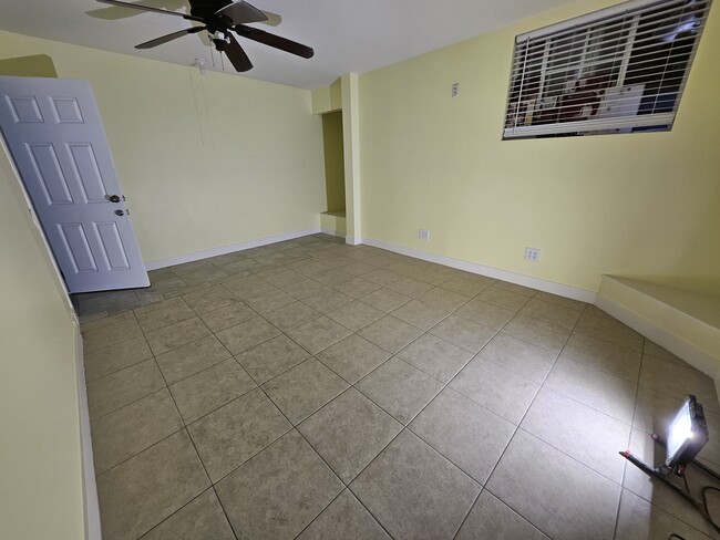 Bedroom/living room. Tiled floors. New air conditioning unit Walk in closet. - 1030 Aldgate Ave