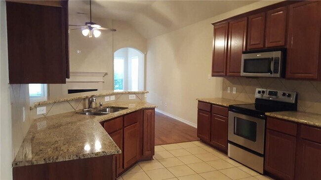Foto del edificio - Charming two-story brick home in the desir...