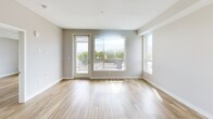 Located at 3909 San Fernando Road in Glendale, California, this contemporary 2-bedroom, 2-bathroom residence offers a thoughtfully designed single-level floor plan with a clean, modern aesthetic throughout. Light wood-style flooring flows seamlessly across the entire unit, creating a warm and cohesive feel.

The open-concept kitchen and living area serve as the heart of the home. The kitchen is outfitted with stainless steel appliances — including a gas range, built-in microwave, dishwasher, and refrigerator — complemented by a striking chevron-patterned tile backsplash, dual-tone cabinetry in white and natural wood, and ample counter space. Recessed lighting illuminates the area effectively.

The living room is bright and airy, with large windows and a glass door opening to a private balcony that offers open outdoor views and generous natural light. Both bedrooms are well-proportioned and comfortable, each featuring ceiling fans, large windows with natural light, and neutral wall tones. The primary bedroom includes a dedicated closet with built-in shelving.

The two bathrooms reflect the same modern finishes found throughout, featuring clean tile work, wood-toned vanity cabinetry, and stone-look countertops. One bathroom includes a soaking tub and shower combination, while the other offers a standalone shower. The unit also includes a dedicated closet for additional storage.