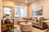 Located at 2333 Calle Del Mundo in Santa Clara, CA, this thoughtfully designed one-bedroom, one-bathroom residence offers a modern and efficient layout across a single floor. Light wood flooring flows throughout, creating a cohesive and warm aesthetic from room to room.

The open-concept kitchen and living area serves as the heart of the home. The kitchen features dark wood cabinetry with sleek hardware, white quartz countertops, a peninsula with an undermount sink, and a full suite of stainless steel appliances including a gas range, microwave, dishwasher, and refrigerator. A white subway tile backsplash adds a clean, contemporary touch. The adjacent living area benefits from a large sliding glass door that fills the space with natural light and provides outdoor access.

The bedroom is a comfortable and well-lit retreat, featuring a window with outdoor views, light wood flooring, and a dedicated closet with open shelving and a full hanging rod for organized storage.

The bathroom is finished in crisp white tones, featuring a dark wood vanity with a white countertop, a full tub-shower combination with tiled surround, and light wood flooring that ties the space together.

A hallway connects all rooms efficiently, completing this well-appointed residence in the heart of Silicon Valley.