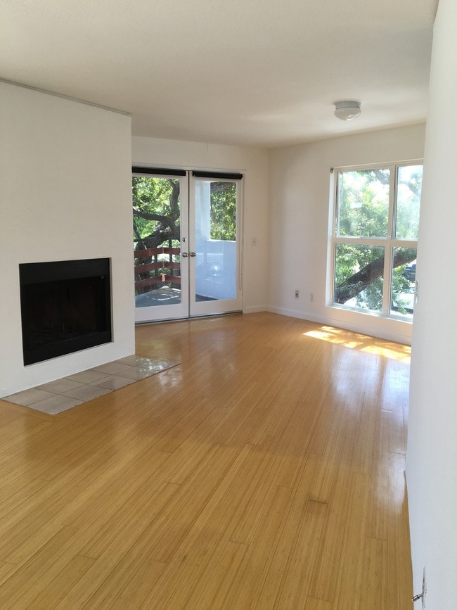 Living room with wood burning fireplace - 2207 Brenta Pl