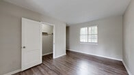 Located at 106 Concord Ave in Anderson, SC, this single-story, 3-bedroom, 1-bathroom home offers a practical and well-organized layout throughout its single floor. The living area features light-toned luxury vinyl plank flooring and neutral gray walls, creating a clean and open atmosphere. A ceiling vent and multiple electrical outlets reflect thoughtful utility placement, while a doorway leads conveniently into the hallway connecting the rest of the home. The kitchen is equipped with white cabinetry, granite-style laminate countertops, a stainless steel sink, and a stainless steel range. A window above the sink allows natural light to brighten the space, complemented by light wood-look vinyl flooring. The bathroom features a full-size tub-shower combo with white tile surround and a window that provides natural ventilation. The generously sized primary bedroom is carpeted and features a ceiling fan, corner windows for ample natural light, and a neutral color palette. The two additional bedrooms are also carpeted, each with windows fitted with blinds. White panel doors and crisp white trim are consistent throughout, lending the home a cohesive, tidy appearance.