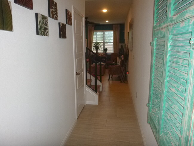Entry and all first floor is hard-tile flooring. - 1001 Zodiac Ln