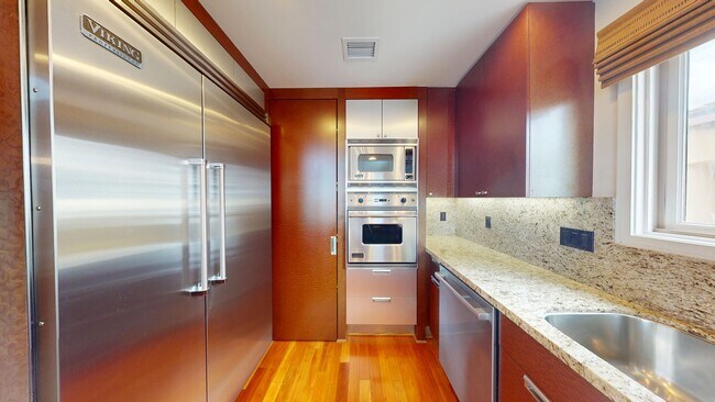 Building Photo - Luxurious Condominium | Rooftop Deck with Bay and Downtown Views