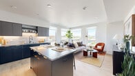 Located at 1110 W Columbia Way in Vancouver, WA, this thoughtfully designed 2-bedroom, 2-bathroom residence offers a modern open-concept layout with light wood flooring and a clean, contemporary aesthetic throughout. The kitchen is a standout feature, showcasing dark navy cabinetry with gold hardware, a subway tile backsplash, stainless steel appliances, and a central island with quartz countertops that doubles as a casual dining space. The kitchen flows seamlessly into the living and dining areas, which are bathed in natural light from large floor-to-ceiling windows offering panoramic city views. A cozy dining nook with corner windows provides an ideal spot to enjoy the elevated urban outlook. The primary bedroom is a well-proportioned retreat featuring light-filtering shades and light wood flooring, while the second bedroom offers similar comfort with generous window coverage. Both bathrooms are finished with modern fixtures; one features a large walk-in glass-enclosed shower with full-height tile surround and matte black hardware. The entry hallway sets a welcoming tone with clean white walls, built-in shelving, and a well-placed hook rail. A dedicated closet adds practical storage. Recessed lighting and a crisp white ceiling complete the refined, contemporary feel of this well-appointed residence.