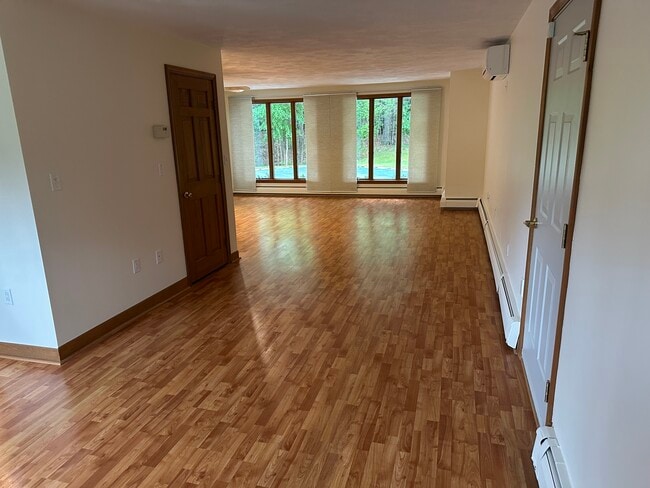 Living Area, closet on left, garage door on right - 24 Haverhill St