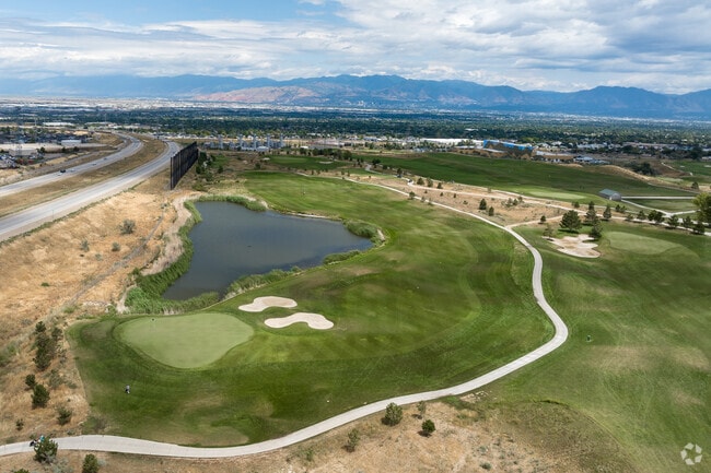 Wide open green space and water features at The Ridge Golf Club.