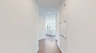 Located in Houston's desirable 77098 zip code, this thoughtfully designed 4-bedroom, 3-bathroom home offers a bright and modern living experience across a single floor. The open-concept kitchen and living area serves as the heart of the home, anchored by a large waterfall-edge island, elegant pendant lighting, white shaker cabinetry, a subway tile backsplash, and premium stainless steel appliances including a professional-grade gas range and built-in beverage cooler. Warm hardwood flooring flows throughout the main living areas, complementing the clean, neutral palette. Each bedroom is generously sized, filled with natural light from large black-framed windows that frame views of the surrounding Houston neighborhood. The primary bedroom features a spacious walk-in closet with built-in shelving. Additional closets provide ample storage throughout. The bathrooms are elegantly finished with marble-look tile, including a full soaking tub with marble surround, illuminated vanity mirrors, and herringbone-tiled flooring in the secondary bath. Ceiling fans in the bedrooms add comfort, while recessed lighting throughout enhances the home's clean, modern aesthetic. The overall ambiance is light, airy, and refined.