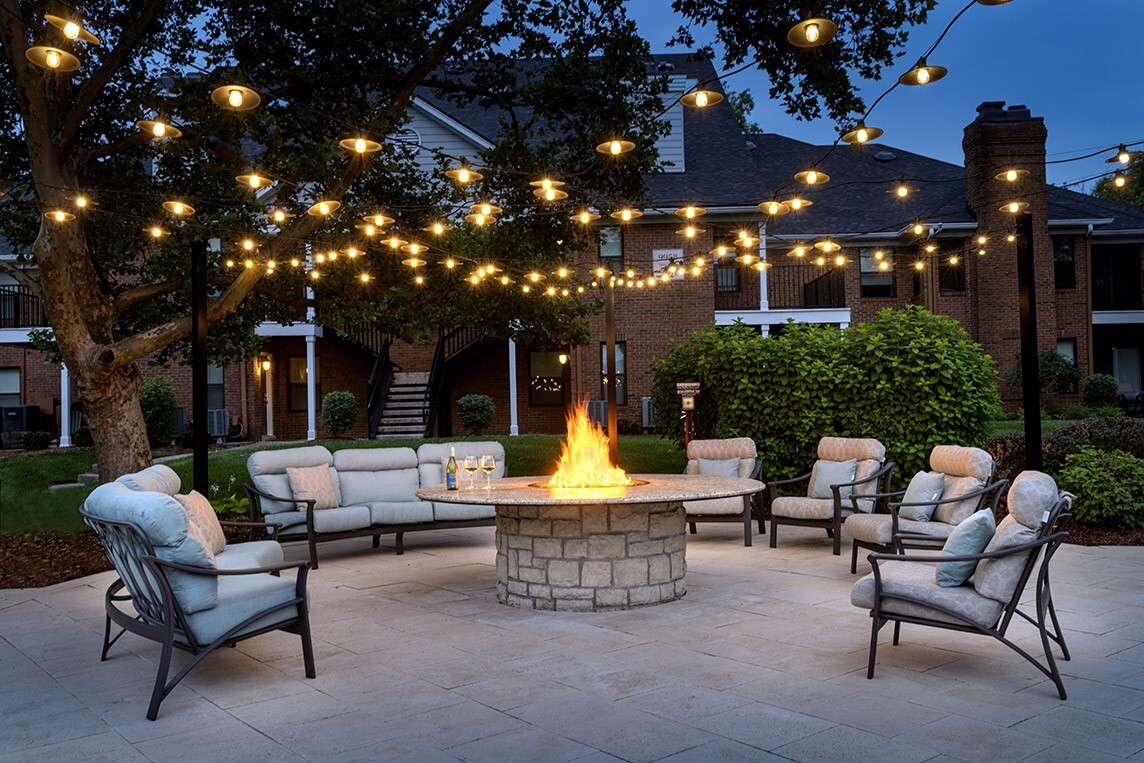 Cozy fire pit at dusk - The Willows of Plainview