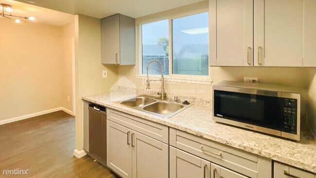 Building Photo - 3 br, 2 bath Triplex - 8950 Rancho Grande ...
