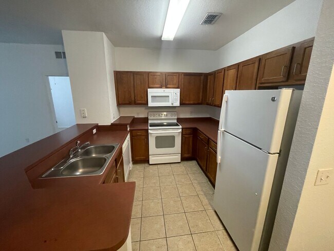 Foto del edificio - 8102 Lillies Way